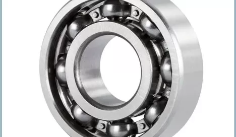 A metal ball bearing with visible balls arranged in a circular track, typically used in turbomachinery by Softinway for reducing friction efficiently.