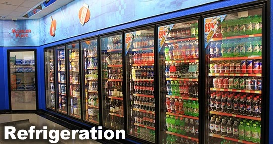 Refrigerated display case filled with various bottled and canned beverages in a store.