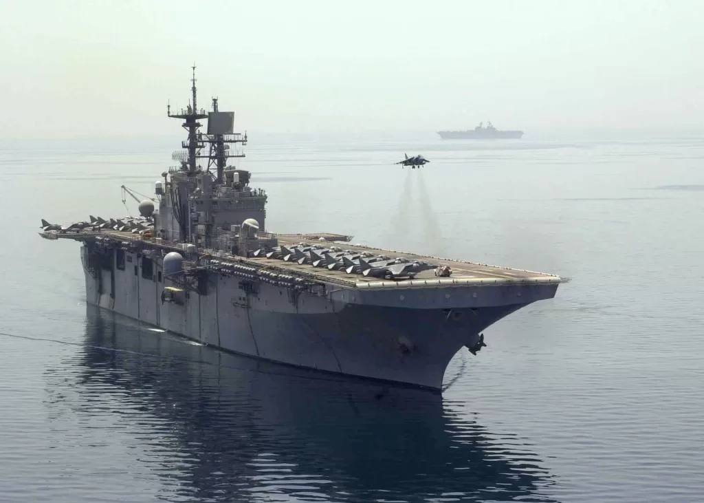 A USMC Harrier above the deck of the USS Bataan