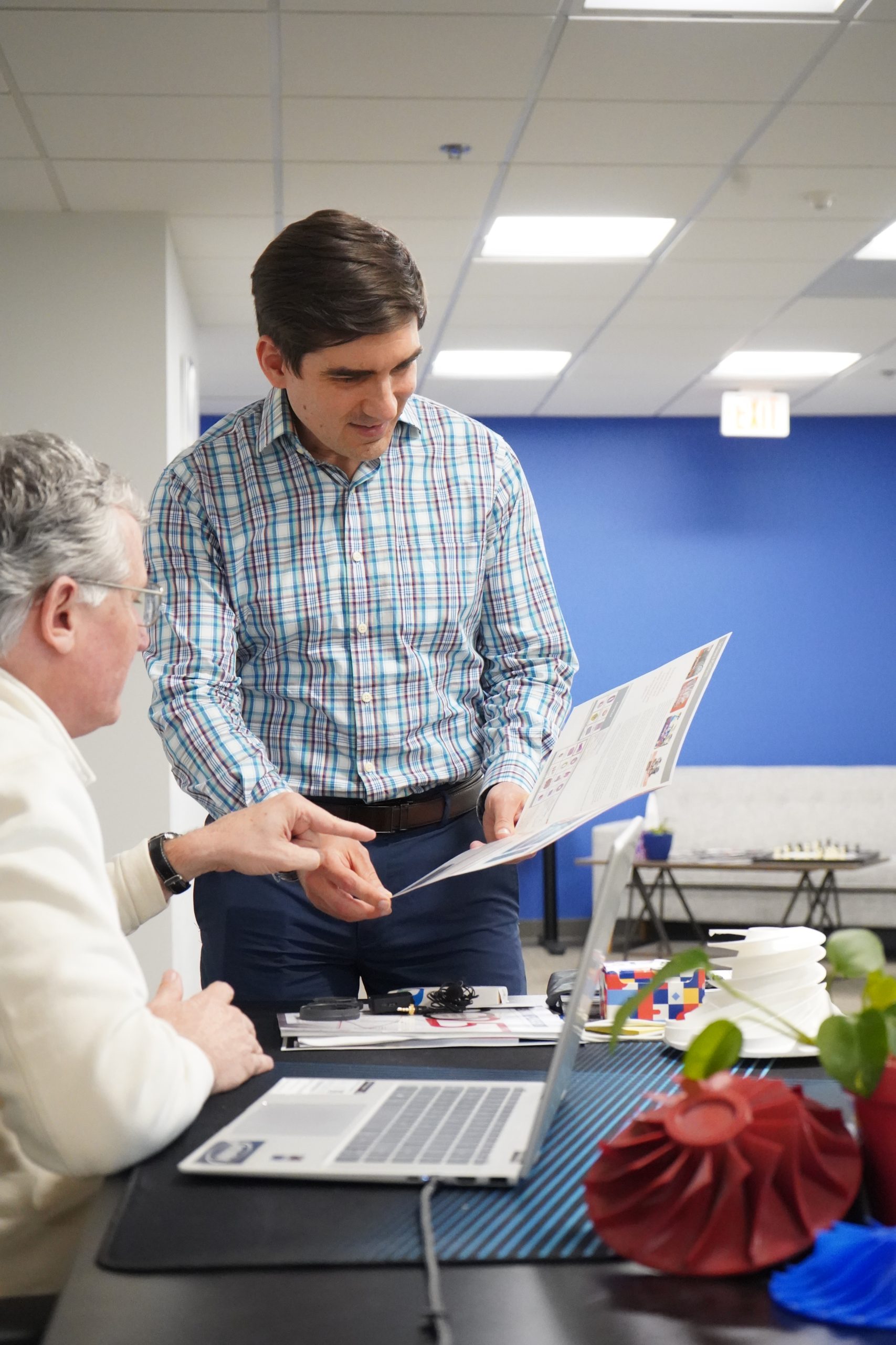Image of Maksym Burlaka collaborating and working with a coworker at SoftInWay
