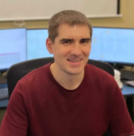 Image of Maksym Burlaka at his desk while working at SoftInWay