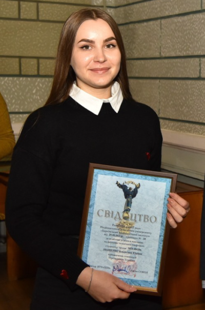 Photo of Vladislava Ivaschenko receiving award at university for being a top engineering student before her internship at SoftInWay
